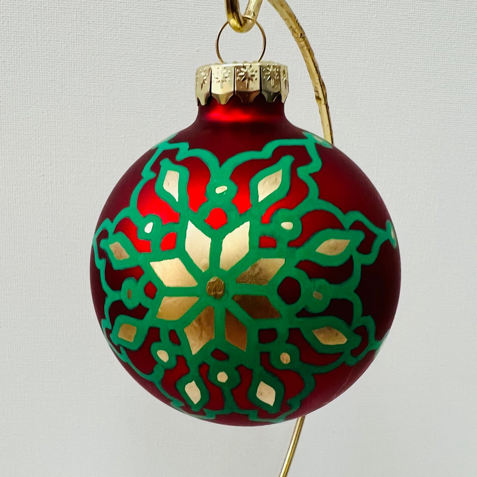 Red Glass Ornament with Hand-Painted Green and Gold Mandala