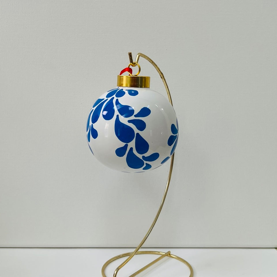 Ivory Ceramic Ornament with Hand-Painted Blue Design