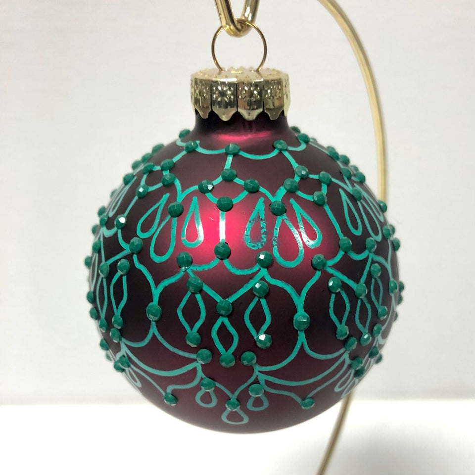 Red Glass Ornament with Hand-painted Green Design with Green Beading