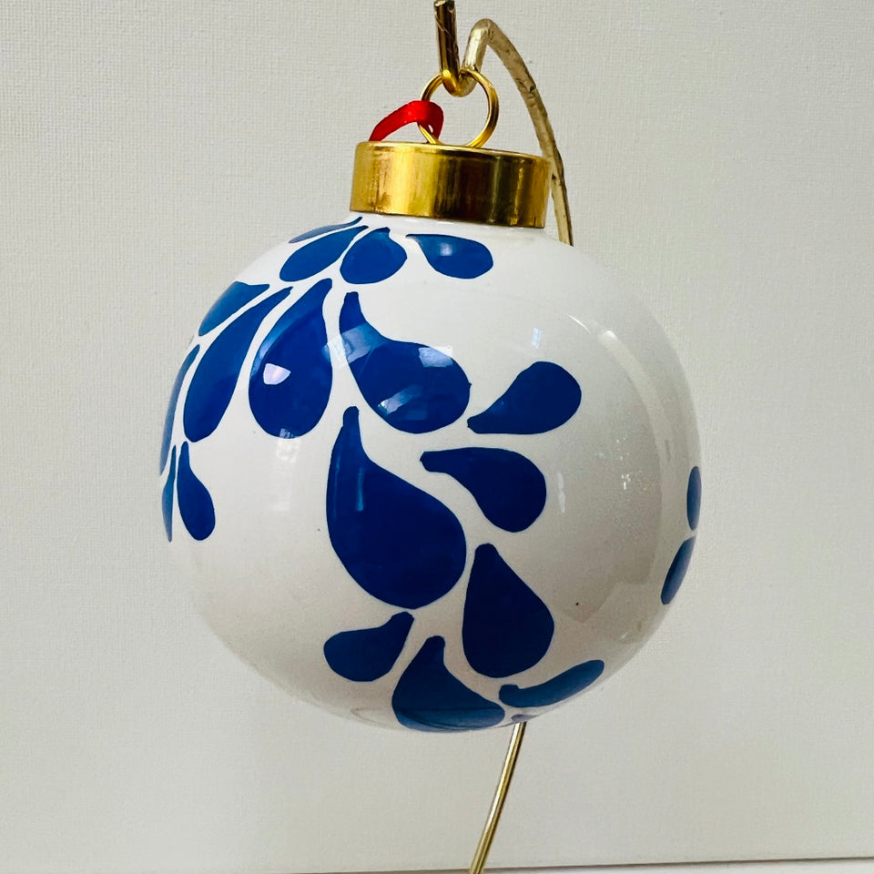 Ivory Ceramic Ornament with Hand-Painted Blue Design