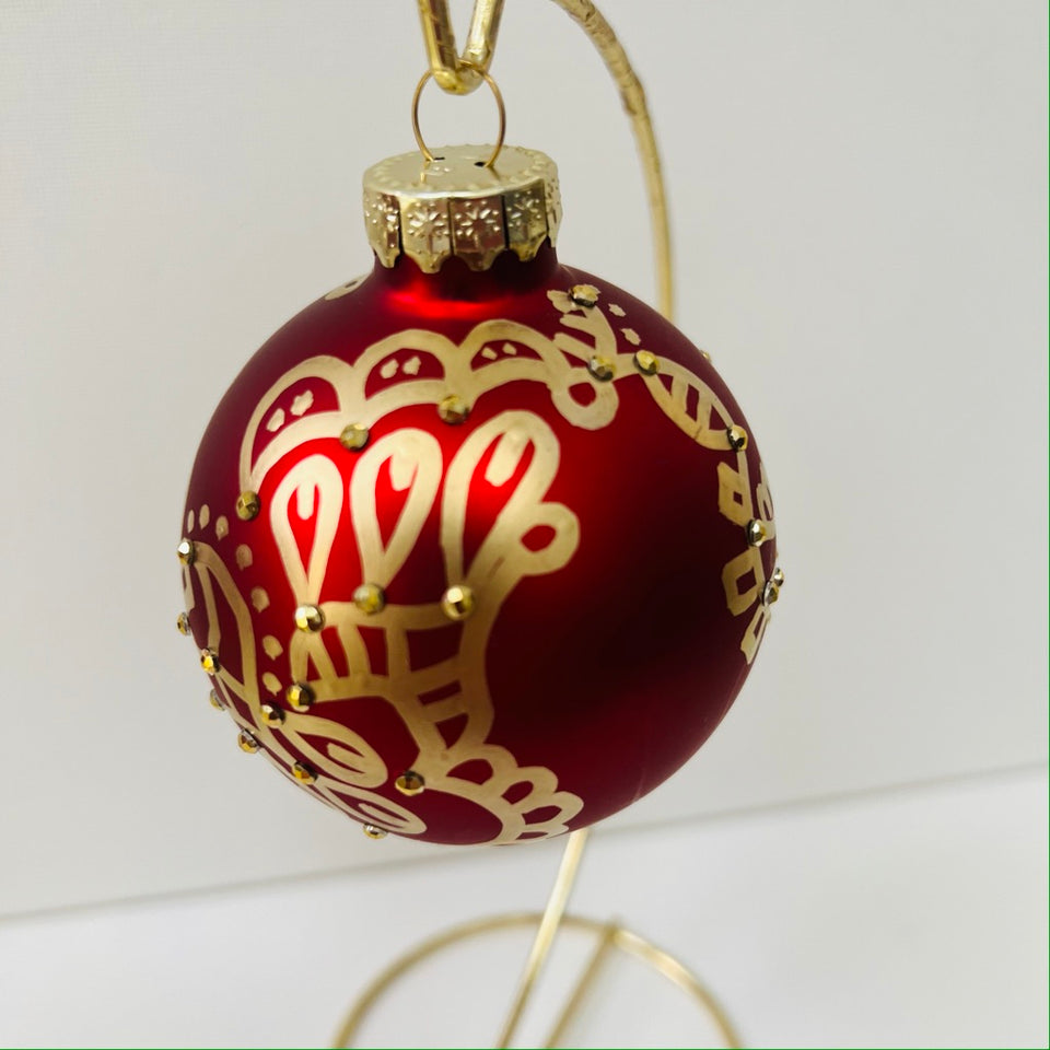 Red Glass Ornament with Hand-Painted Gold Design