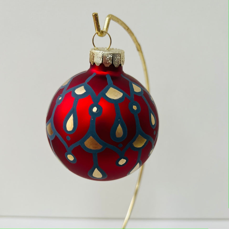 Red Glass Ornament with Hand-Painted Dusty Blue and Gold Design