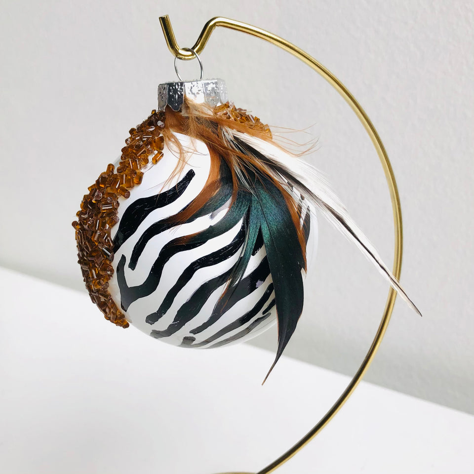 White Glass Ornament with Zebra & Feather Detail
