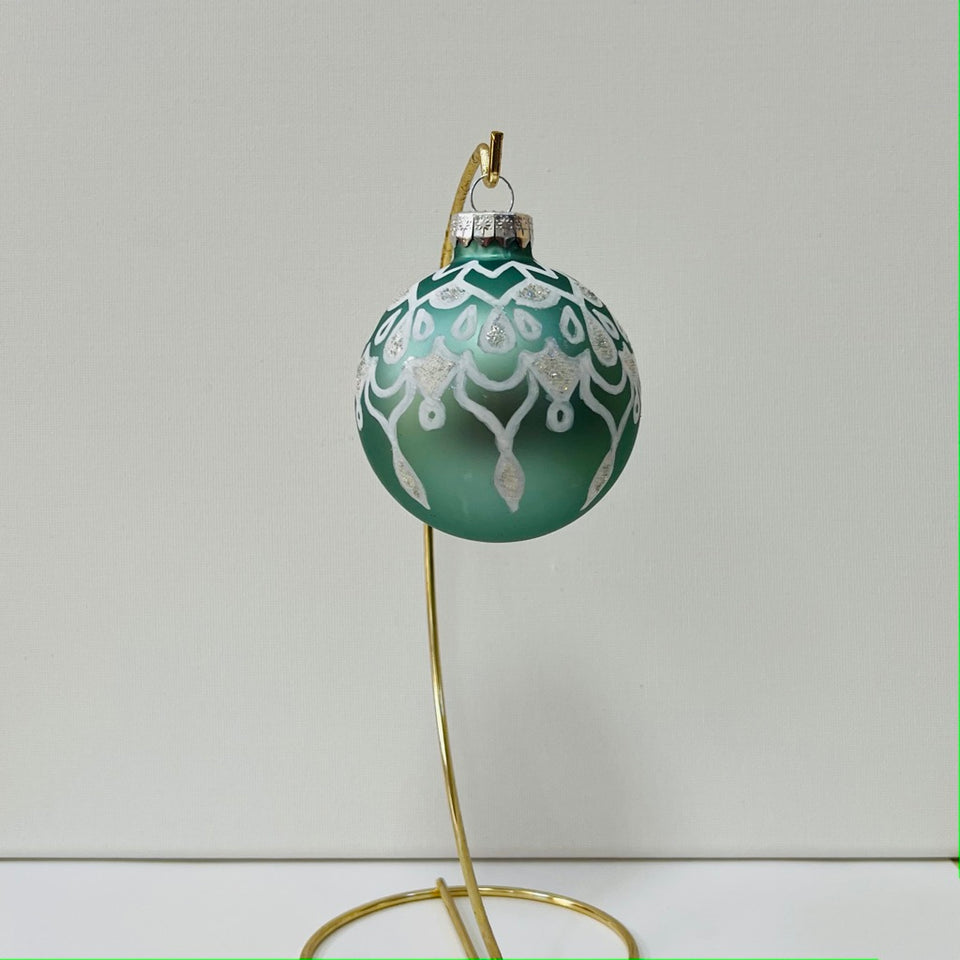 Seafoam Green Glass Ornament with Hand-Painted White and Frosted Design.