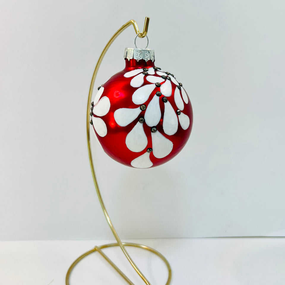 Red Glass Ornament with Hand-painted White Design