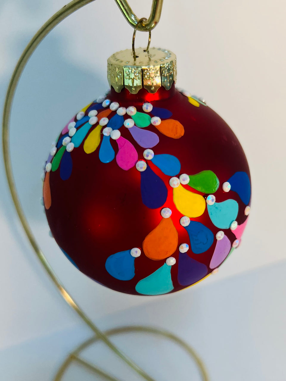 Red Glass Ornament with Hand-painted Design and White Beading