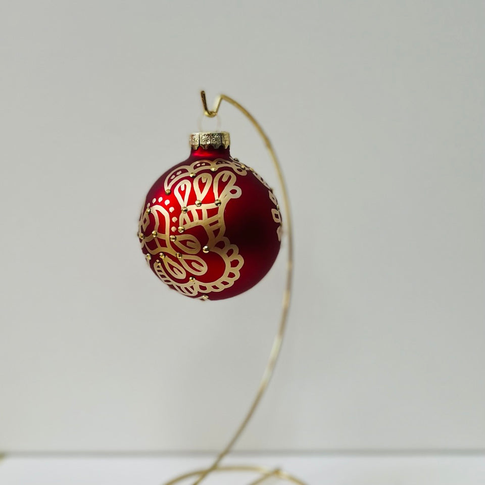 Red Glass Ornament with Hand-Painted Gold Design