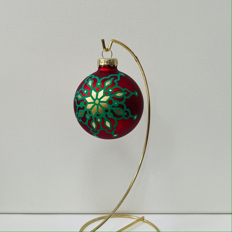 Red Glass Ornament with Hand-Painted Green and Gold Mandala